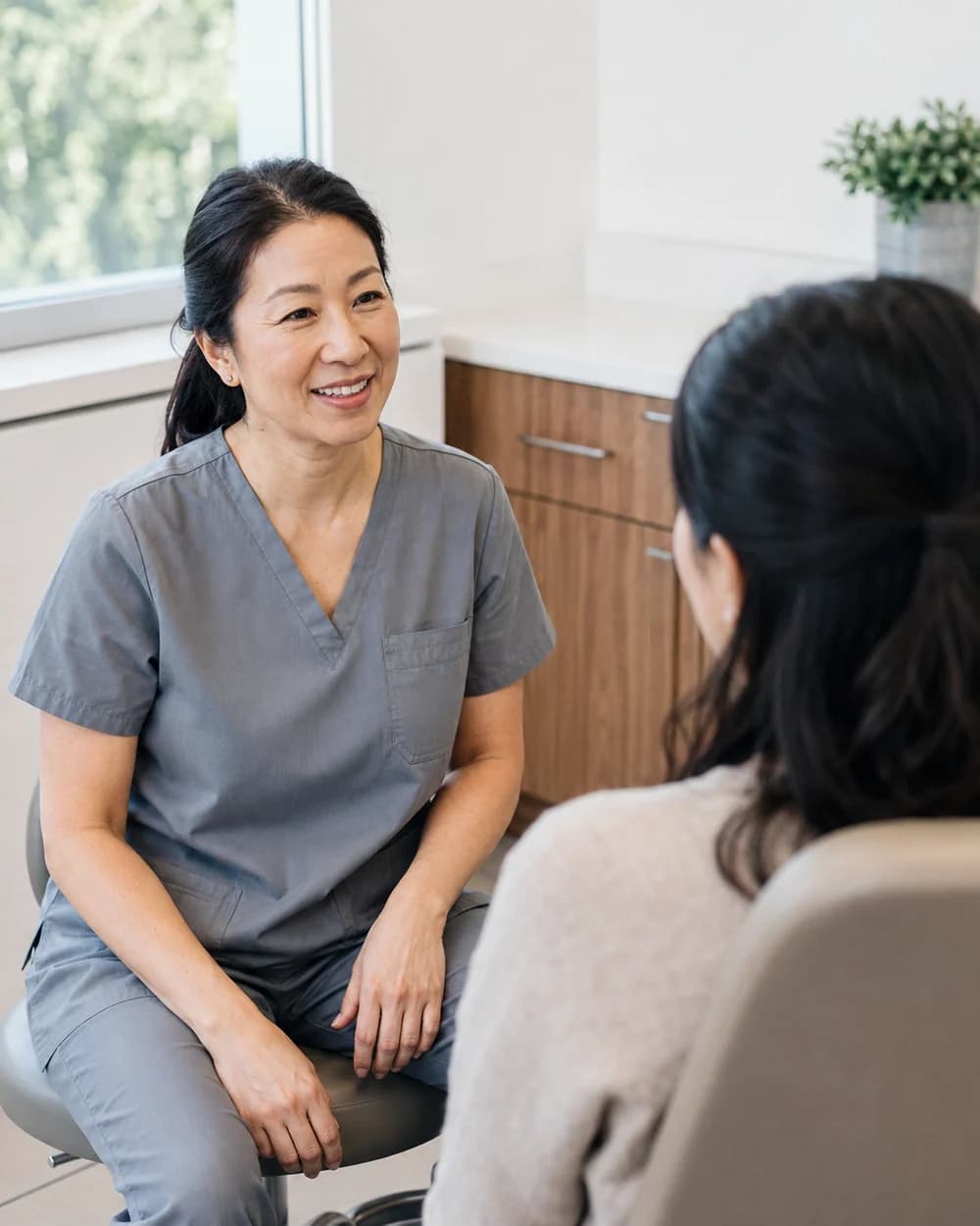 A dentist talking with a patient
